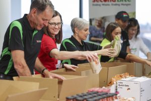SecondBite CEO Steve Clifford and staff pack boxes for our agency partners